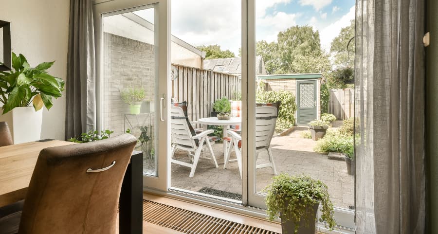 Sliding glass door at home leading to an outdoor living space